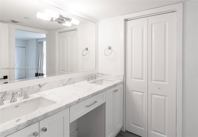 6061 Collins Ave Unit 7D, Miami Beach, FL 33140 - bathroom with double vanity and a closet