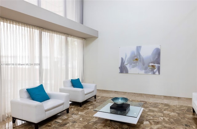 6061 Collins Ave Unit 7D, Miami Beach, FL 33140 - living area featuring a towering ceiling