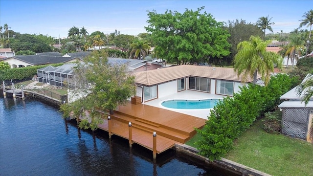 1910 NW 36th St, Oakland Park, FL 33309 - back of house with a water view and a tile roof