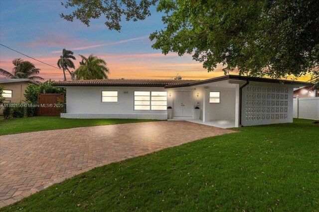 1910 NW 36th St, Oakland Park, FL 33309 - view of front of home featuring stucco siding and a tile roof