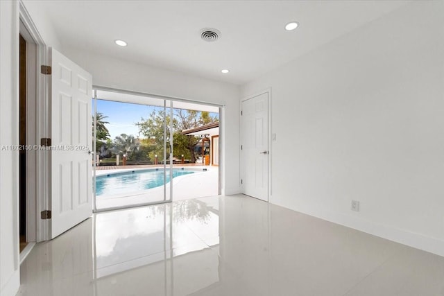 1910 NW 36th St, Oakland Park, FL 33309 - tiled spare room with recessed lighting