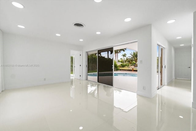 1910 NW 36th St, Oakland Park, FL 33309 - empty room featuring recessed lighting and light tile patterned floors