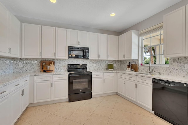 2521 Hunters Run Way, Weston, FL 33327 - kitchen with black appliances, a sink, white cabinets, tasteful backsplash, and recessed lighting
