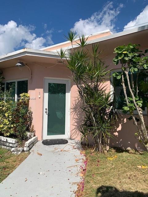 1785 Calais Dr Unit 7, Miami Beach, FL 33141 - property entrance with stucco siding
