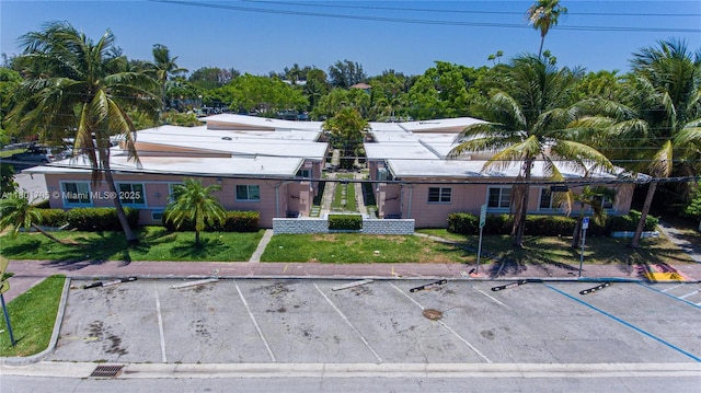 1785 Calais Dr Unit 7, Miami Beach, FL 33141 - view of front of home featuring uncovered parking and a front lawn