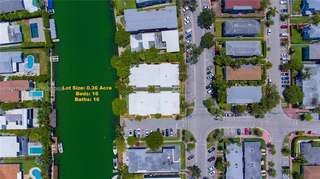 1785 Calais Dr Unit 7, Miami Beach, FL 33141 - aerial overview of property's location with nearby suburban area and a large body of water