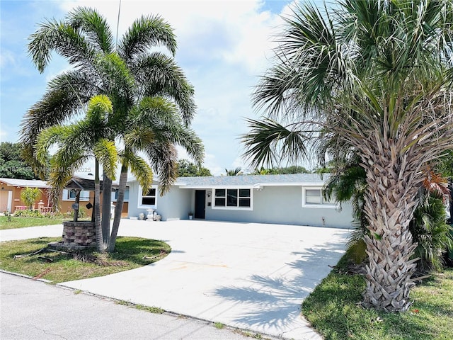 8761 NW 12th St, Pembroke Pines, FL 33024 - view of front facade with driveway and stucco siding