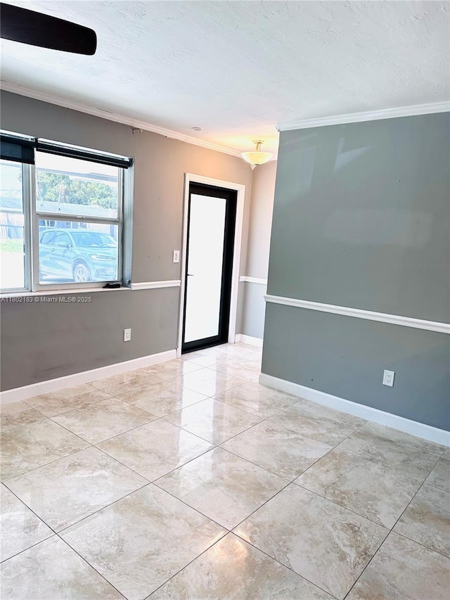 8761 NW 12th St, Pembroke Pines, FL 33024 - spare room with ornamental molding, baseboards, and a textured ceiling