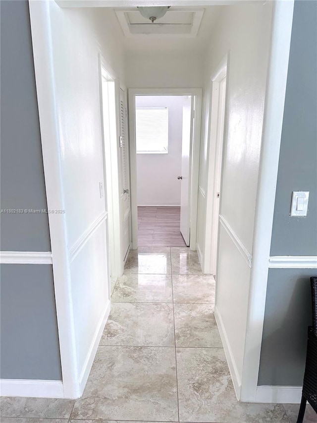 8761 NW 12th St, Pembroke Pines, FL 33024 - hallway featuring attic access and baseboards