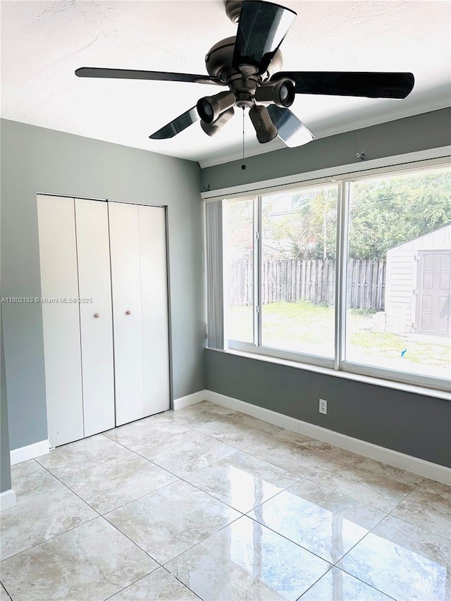 8761 NW 12th St, Pembroke Pines, FL 33024 - unfurnished bedroom with multiple windows, baseboards, and ceiling fan