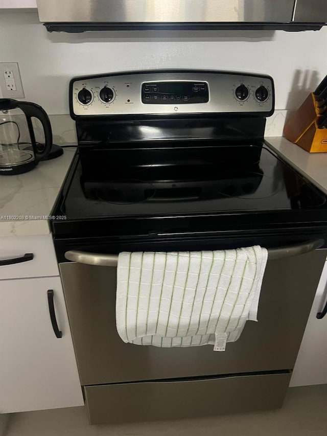 17150 N Bay Rd Unit 2218, Sunny Isles Beach, FL 33160 - kitchen view of stainless steel range with electric cooktop and light countertops