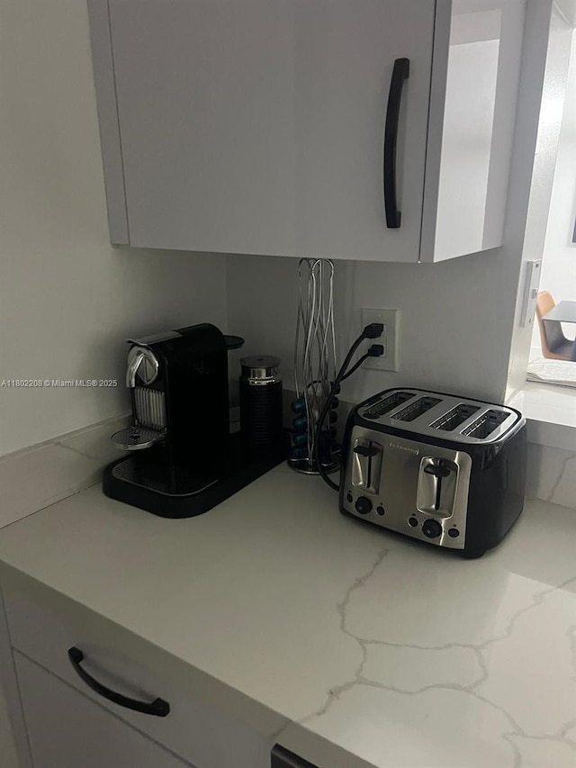 17150 N Bay Rd Unit 2218, Sunny Isles Beach, FL 33160 - kitchen view of white cabinetry and light stone countertops