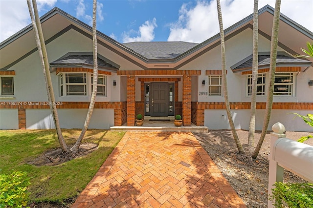 2898 SW 2nd Ave, Miami, FL 33129 - view of front facade featuring brick siding and a shingled roof