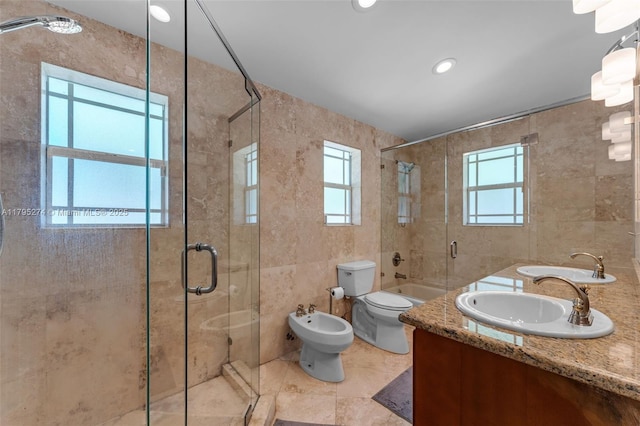 2898 SW 2nd Ave, Miami, FL 33129 - bathroom with tile walls, healthy amount of natural light, tiled shower, toilet, and a bidet