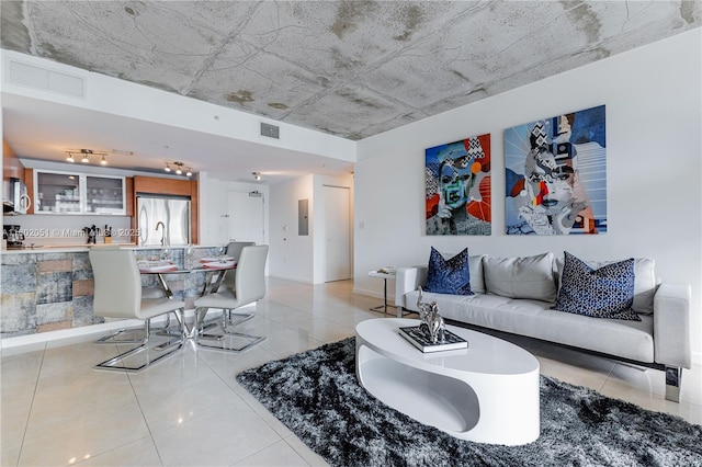 3250 NE 1st Ave Unit 702, Miami, FL 33137 - living area featuring light tile patterned floors and baseboards