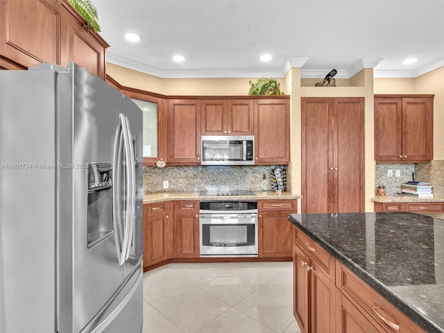 4960 SW 158th Ave, Miramar, FL 33027 - kitchen featuring stainless steel appliances, brown cabinets, ornamental molding, dark stone countertops, and tasteful backsplash