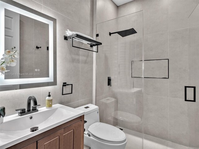 4960 SW 158th Ave, Miramar, FL 33027 - bathroom featuring tiled shower, vanity, and tile walls