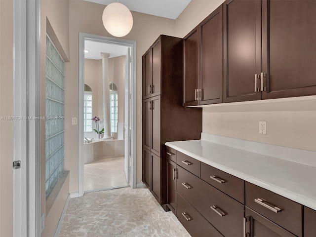 4960 SW 158th Ave, Miramar, FL 33027 - kitchen featuring dark brown cabinetry and light countertops