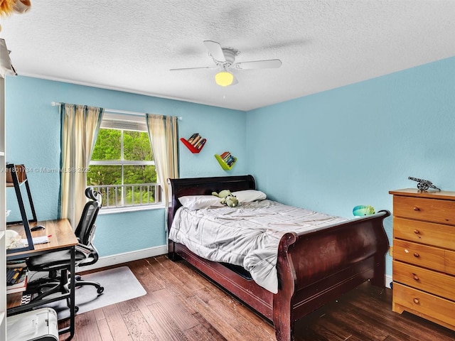 4960 SW 158th Ave, Miramar, FL 33027 - bedroom with baseboards, hardwood / wood-style flooring, an office area, ceiling fan, and a textured ceiling
