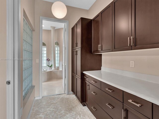 4960 SW 158th Ave, Miramar, FL 33027 - kitchen featuring dark brown cabinets and light countertops