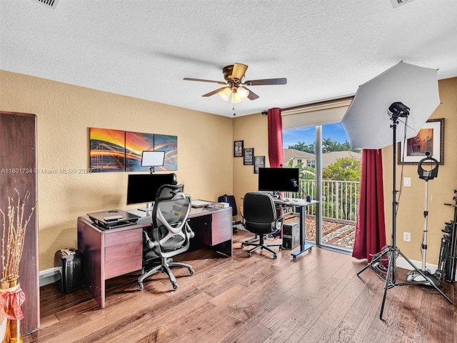 4960 SW 158th Ave, Miramar, FL 33027 - home office with wood finished floors, a ceiling fan, a textured wall, and a textured ceiling
