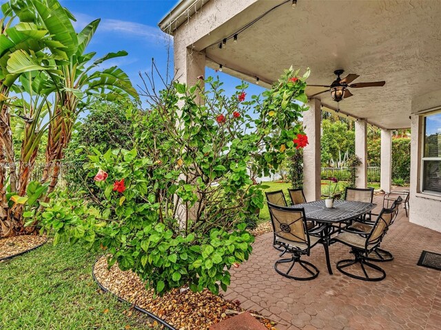 4960 SW 158th Ave, Miramar, FL 33027 - view of patio / terrace with a ceiling fan and outdoor dining space