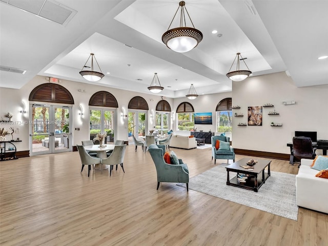 4960 SW 158th Ave, Miramar, FL 33027 - living area featuring a tray ceiling, light wood finished floors, french doors, plenty of natural light, and recessed lighting