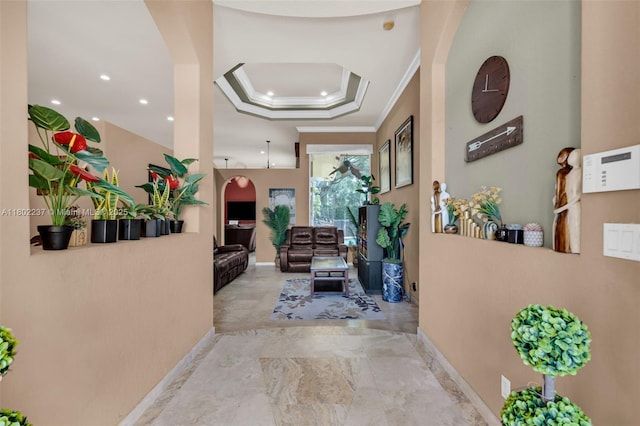 18951 SW 30th St, Miramar, FL 33029 - hallway featuring arched walkways, crown molding, a raised ceiling, recessed lighting, and baseboards