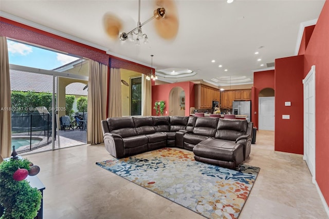 18951 SW 30th St, Miramar, FL 33029 - living room with arched walkways, crown molding, baseboards, and recessed lighting