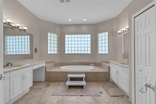 18951 SW 30th St, Miramar, FL 33029 - full bathroom with plenty of natural light, two vanities, a garden tub, and recessed lighting