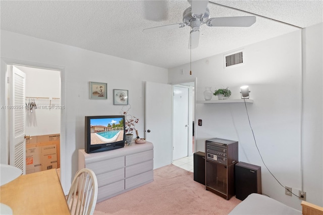 700 SE 6th Ave Unit 314, Deerfield Beach, FL 33441 - bedroom with light carpet, a textured ceiling, and ceiling fan