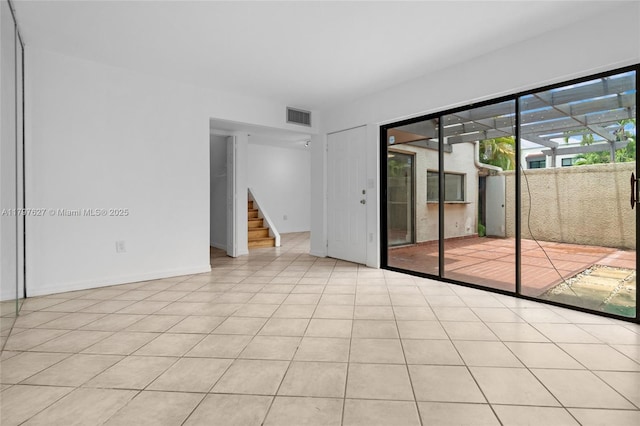 4718 SW 67th Ave Unit B6, Miami, FL 33155 - spare room featuring stairway and light tile patterned floors