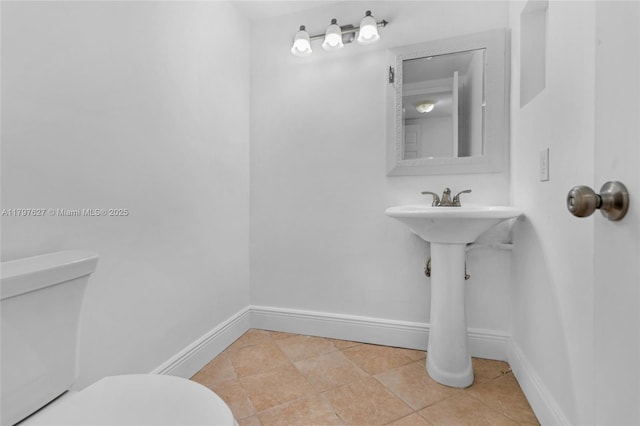 4718 SW 67th Ave Unit B6, Miami, FL 33155 - half bathroom featuring toilet, baseboards, and tile patterned floors