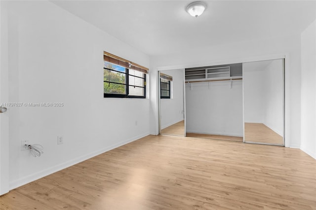 4718 SW 67th Ave Unit B6, Miami, FL 33155 - unfurnished bedroom with light wood-style floors, baseboards, and a closet