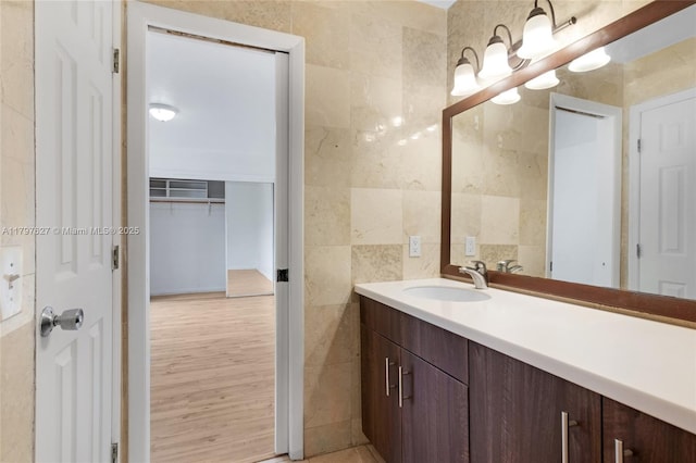 4718 SW 67th Ave Unit B6, Miami, FL 33155 - bathroom featuring tile walls, vanity, and a closet