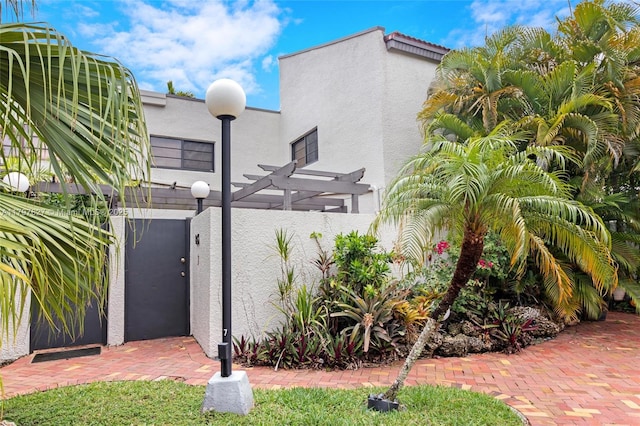 4718 SW 67th Ave Unit B6, Miami, FL 33155 - view of side of property with stucco siding and a pergola
