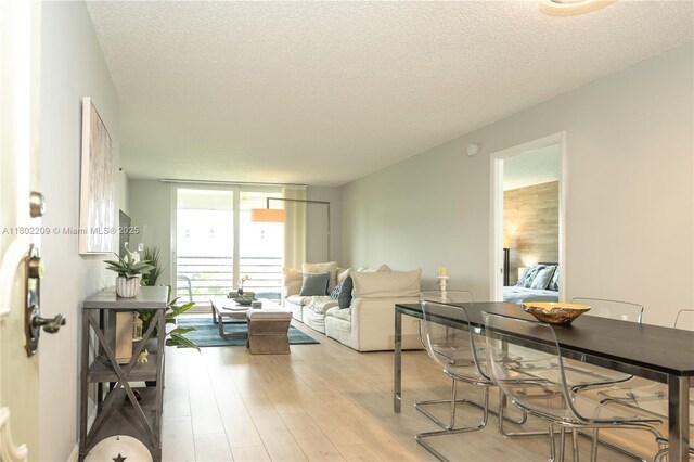 900 Saint Charles Pl Unit 621, Pembroke Pines, FL 33026 - living room with a textured ceiling, light wood-type flooring, and expansive windows