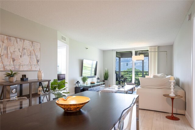 900 Saint Charles Pl Unit 621, Pembroke Pines, FL 33026 - dining area featuring expansive windows and light wood-style floors