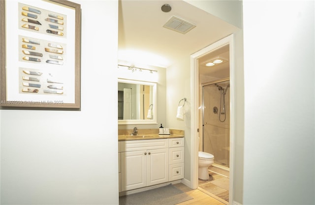 900 Saint Charles Pl Unit 621, Pembroke Pines, FL 33026 - bathroom with a shower stall, vanity, toilet, and wood finished floors