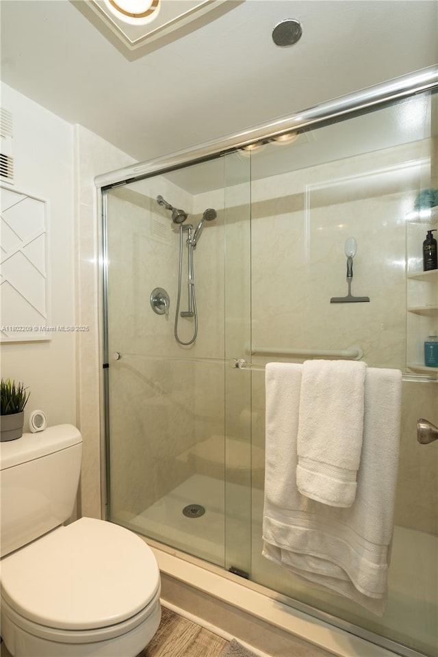 900 Saint Charles Pl Unit 621, Pembroke Pines, FL 33026 - full bath with a shower stall, toilet, and wood finished floors