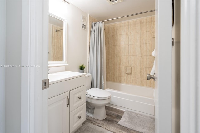 900 Saint Charles Pl Unit 621, Pembroke Pines, FL 33026 - bathroom featuring vanity, wood finished floors, toilet, and shower / tub combo with curtain