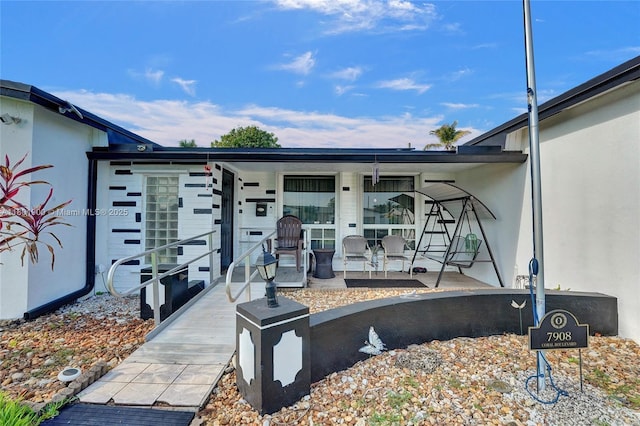 7908 Coral Blvd, Miramar, FL 33023 - doorway to property featuring a porch