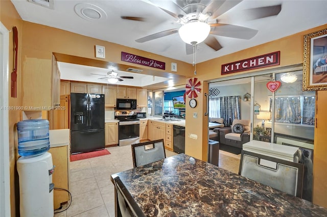 7908 Coral Blvd, Miramar, FL 33023 - kitchen featuring black appliances, a ceiling fan, light tile patterned flooring, and light brown cabinetry