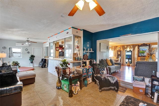 7908 Coral Blvd, Miramar, FL 33023 - living area with ceiling fan, light tile patterned floors, healthy amount of natural light, a wall mounted air conditioner, and a textured ceiling