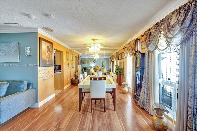 7908 Coral Blvd, Miramar, FL 33023 - dining area with a textured ceiling, crown molding, light wood-style flooring, baseboards, and ceiling fan