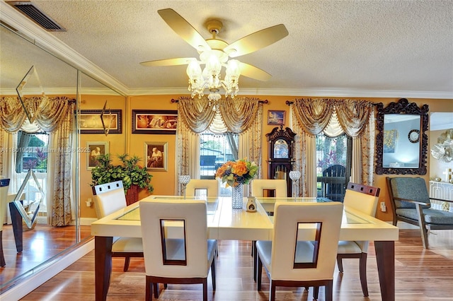 7908 Coral Blvd, Miramar, FL 33023 - dining room with a textured ceiling, crown molding, wood finished floors, and ceiling fan