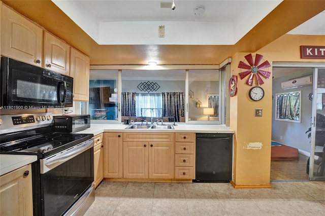 7908 Coral Blvd, Miramar, FL 33023 - kitchen featuring black appliances, light brown cabinetry, a sink, light countertops, and light tile patterned floors