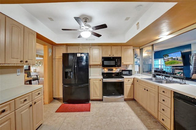 7908 Coral Blvd, Miramar, FL 33023 - kitchen with black appliances, a sink, light brown cabinets, and ceiling fan