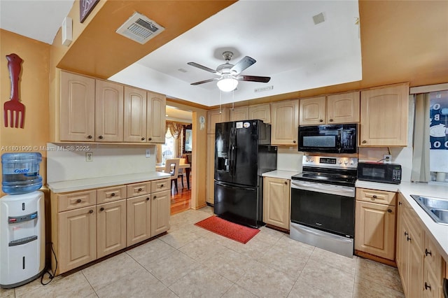 7908 Coral Blvd, Miramar, FL 33023 - kitchen featuring black appliances, light brown cabinets, light countertops, and a ceiling fan