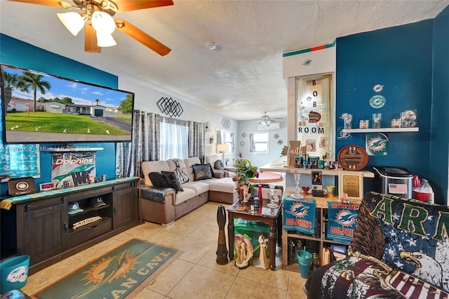 7908 Coral Blvd, Miramar, FL 33023 - living area featuring a ceiling fan, light tile patterned flooring, and a textured ceiling